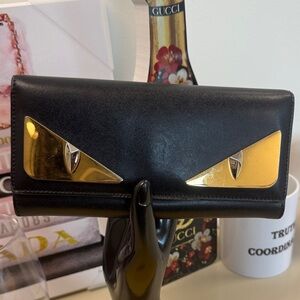 Fendi Black Leather Wallet with Gold Eye Accents